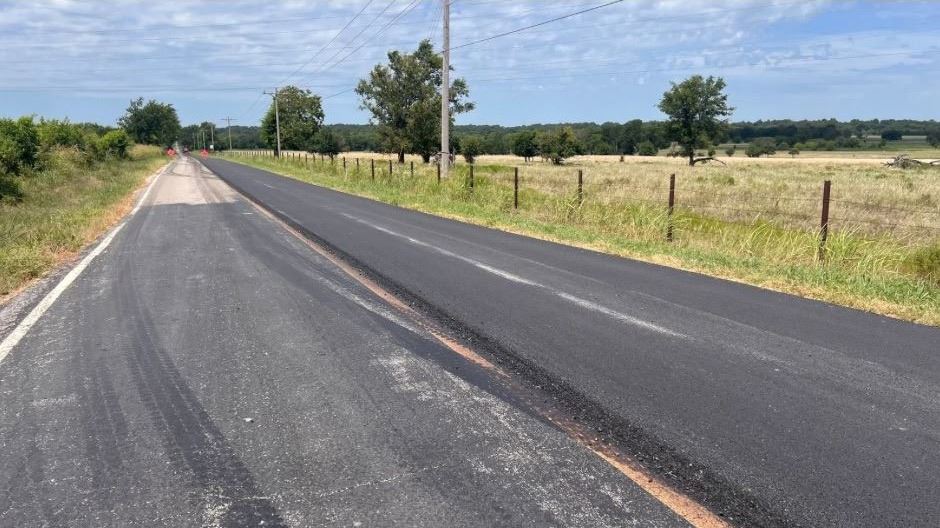 E. 430 Road showing black pavement and greenery